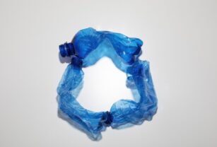 flat-lay-blue-plastic-bottles-arrangement