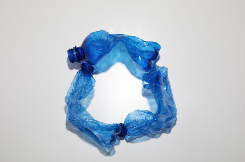 flat-lay-blue-plastic-bottles-arrangement