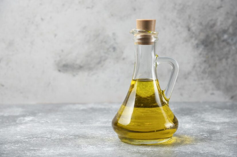 Olive oil bottle on marble table